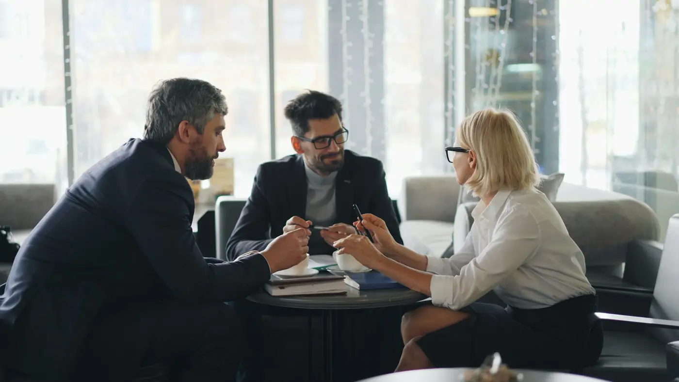 A sale agreed at a meeting table